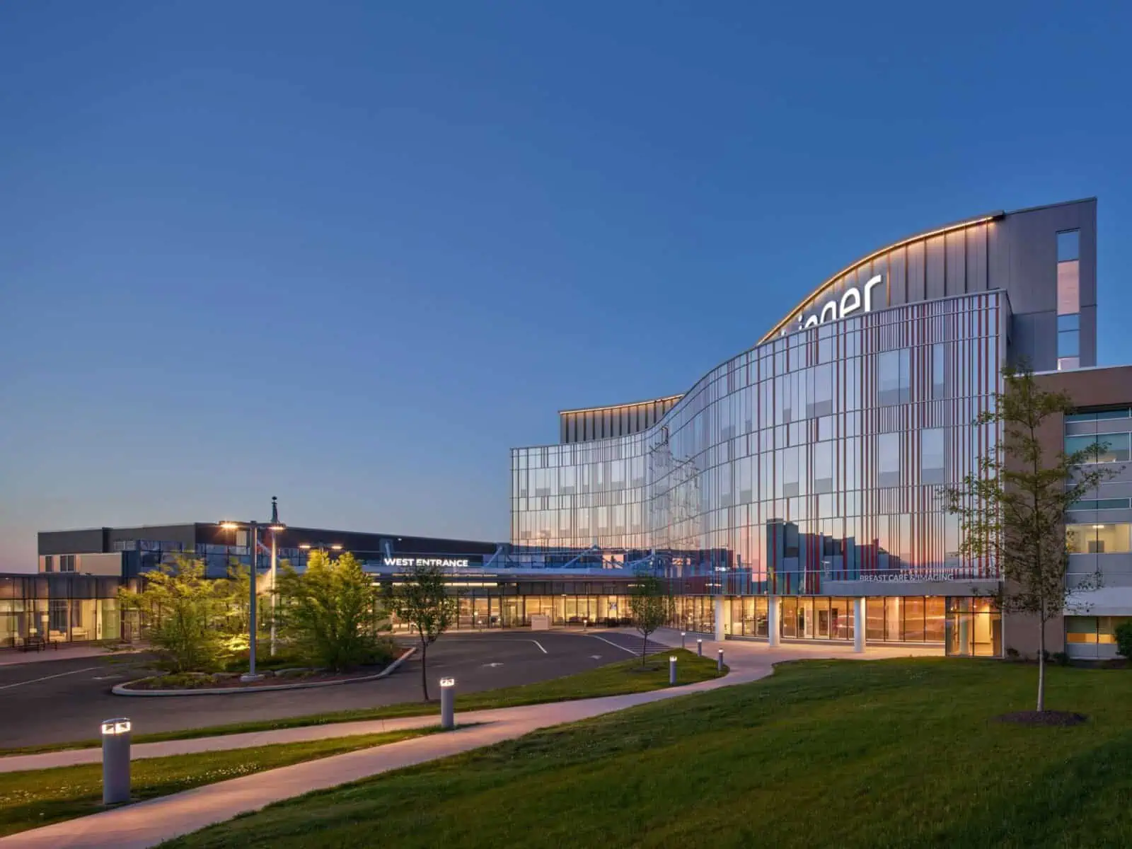 YKK building exterior with modern glass architecture at dusk.