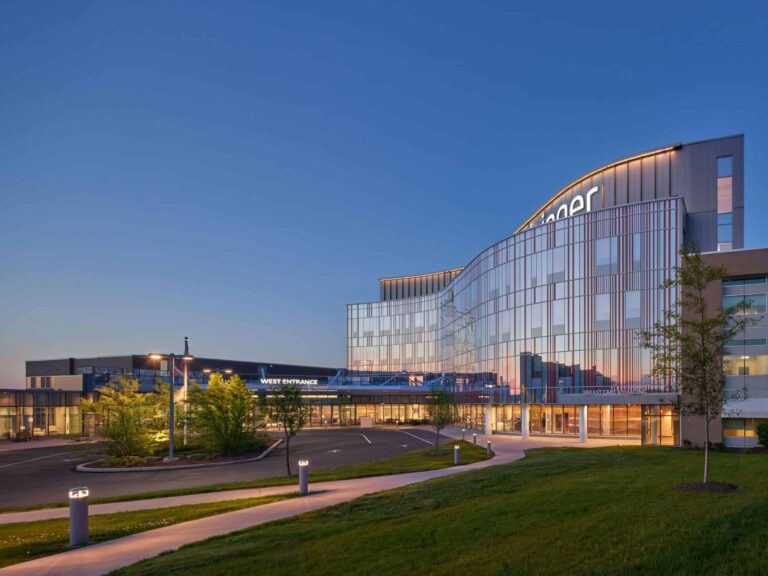 YKK building exterior with modern glass architecture at dusk.