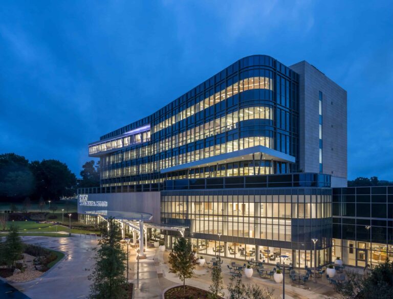 YKK corporate office building with modern glass architecture at dusk.