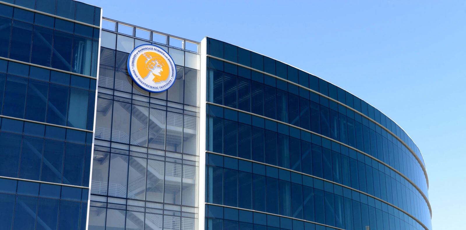 YKK logo on modern glass office building facade.