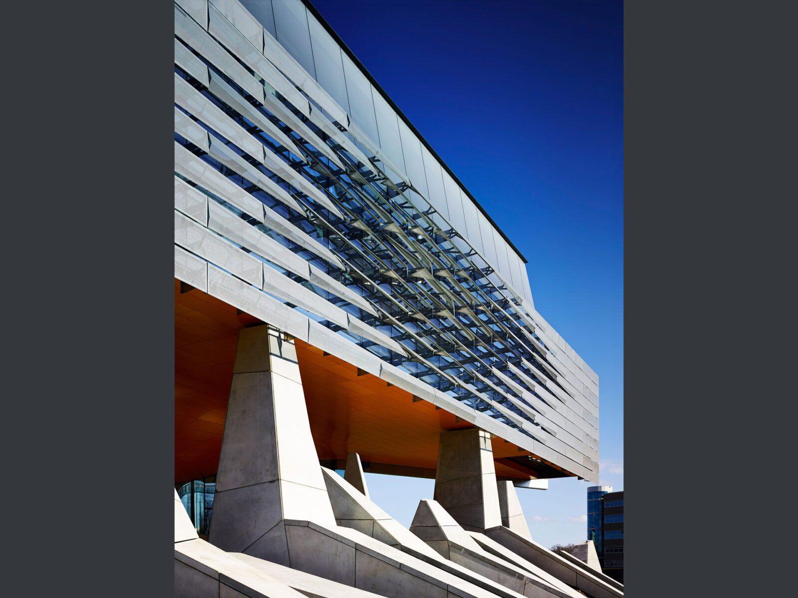 Contemporary YKK building with glass facade and unique design.