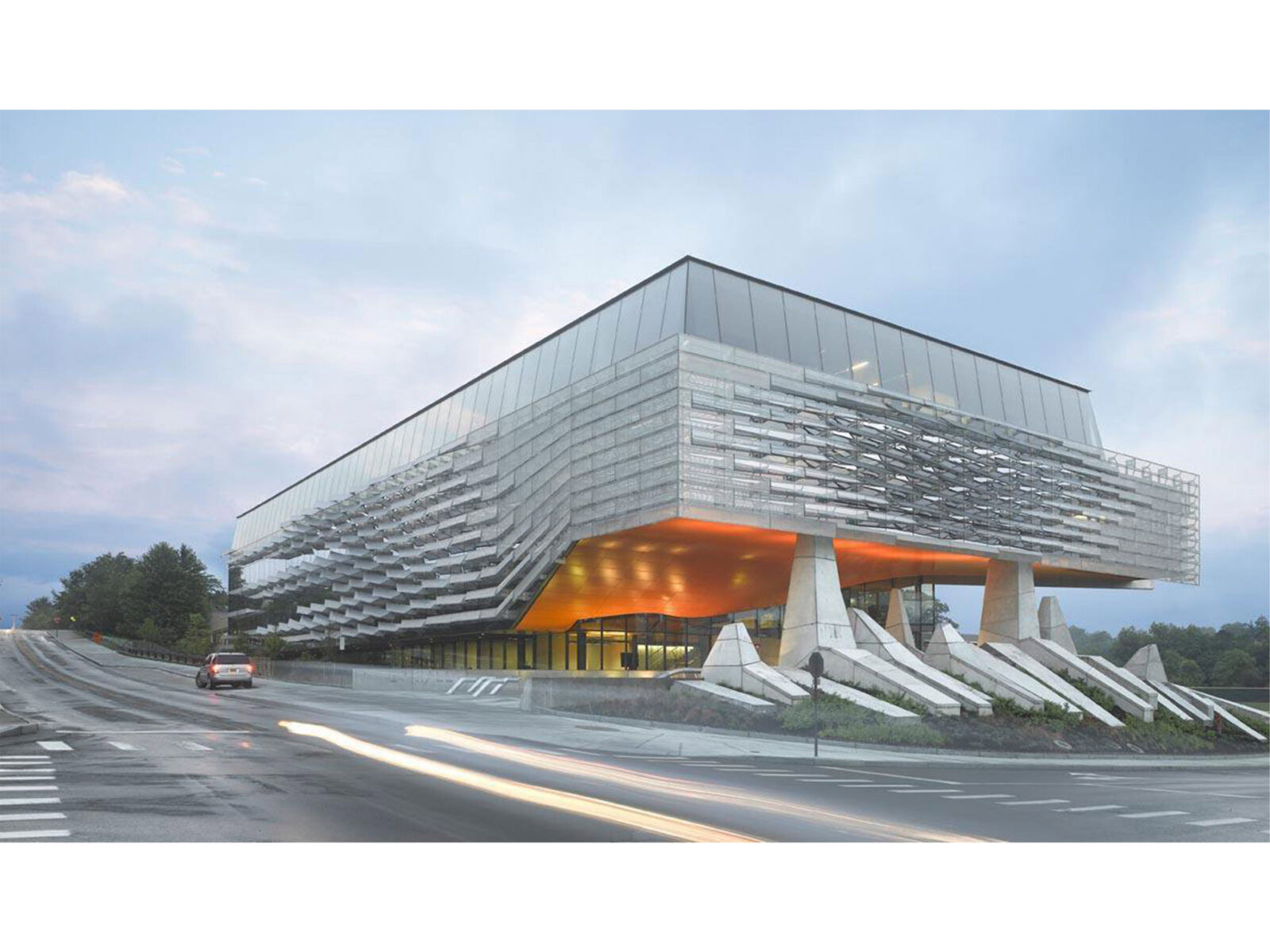 Contemporary YKK office building with glass facade and unique design.