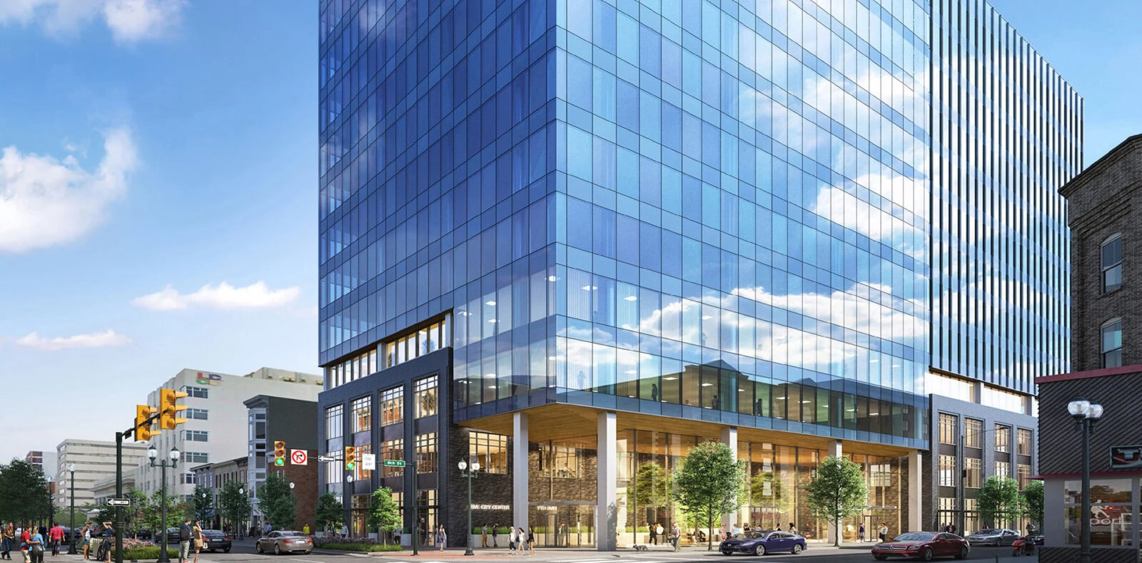 YKK modern glass office building with reflective windows and urban surroundings.