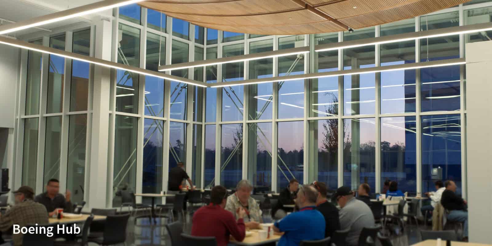 Boeing Hub interior with large glass windows and seating area.