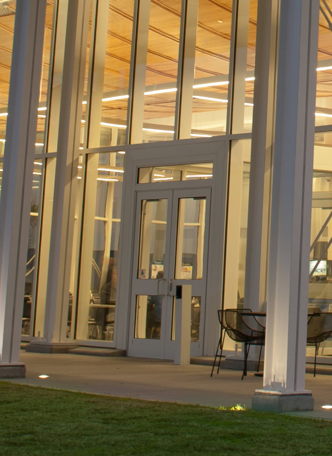 YKK glass building entrance with modern architectural design.