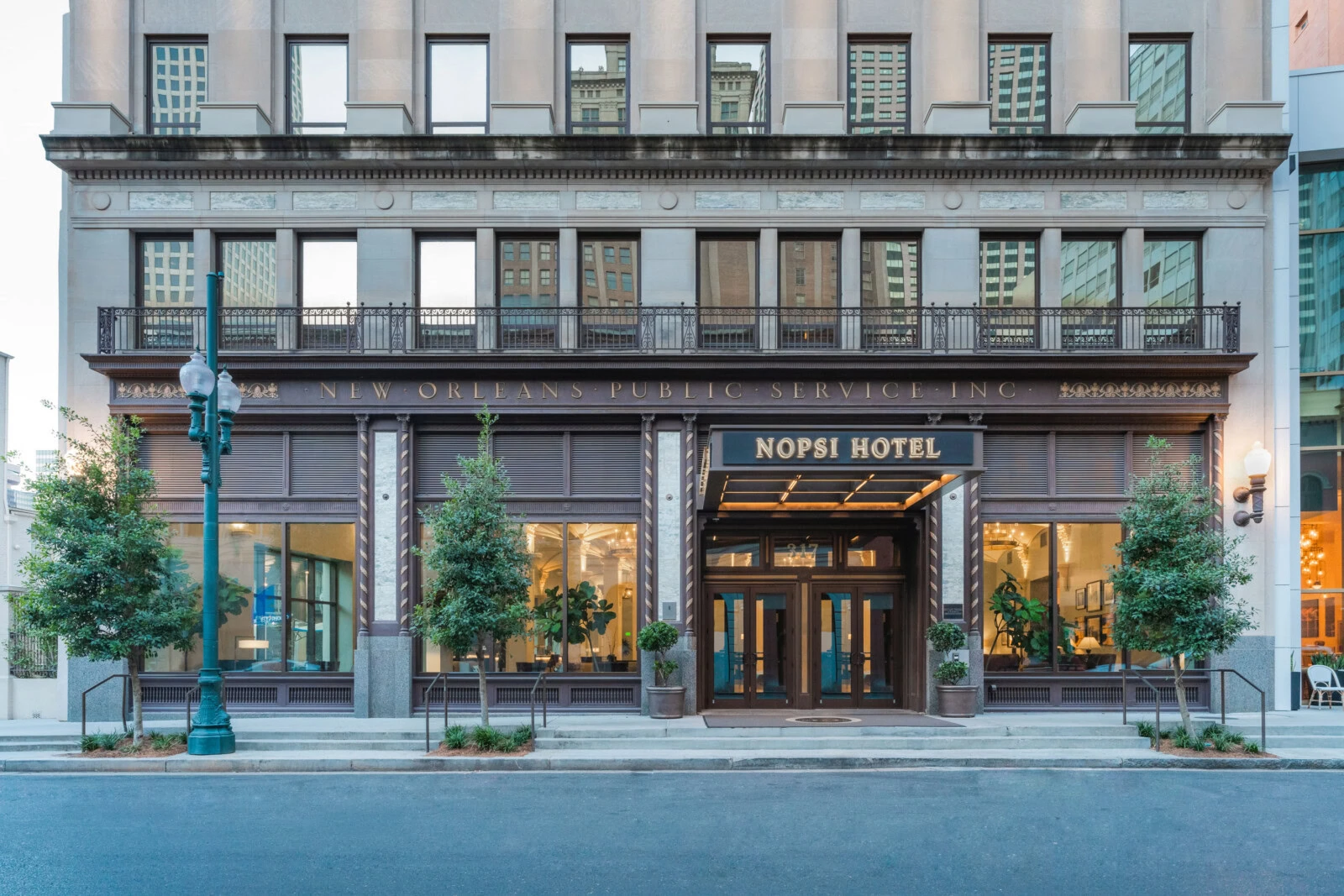 Exterior view of NOPSI Hotel in New Orleans with historic architecture.