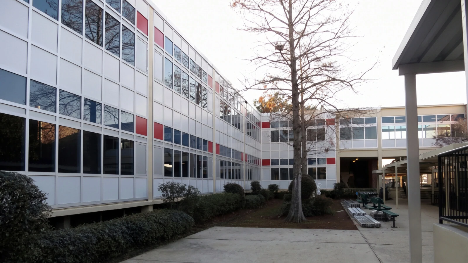 YKK building exterior at Archbishop Rummel High School with modern windows and a.
