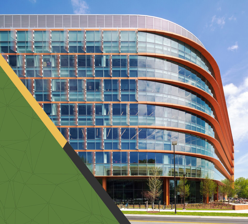Contemporary glass office building with curved design and orange accents.